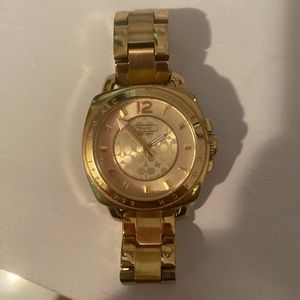 Gold Watch Coach , in good condition, has no scratches or broken